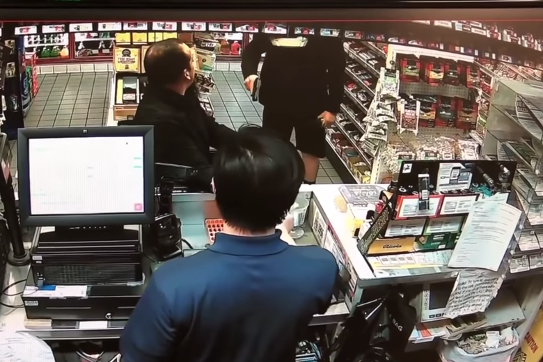A screenshot of the surveillance video shows the moment the police officer pulled out his gun on Jose Arreola in Buena Park, California.